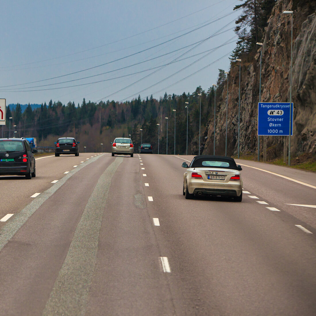A rental car traversing the scenic route from downtown Oslo towards the airport
